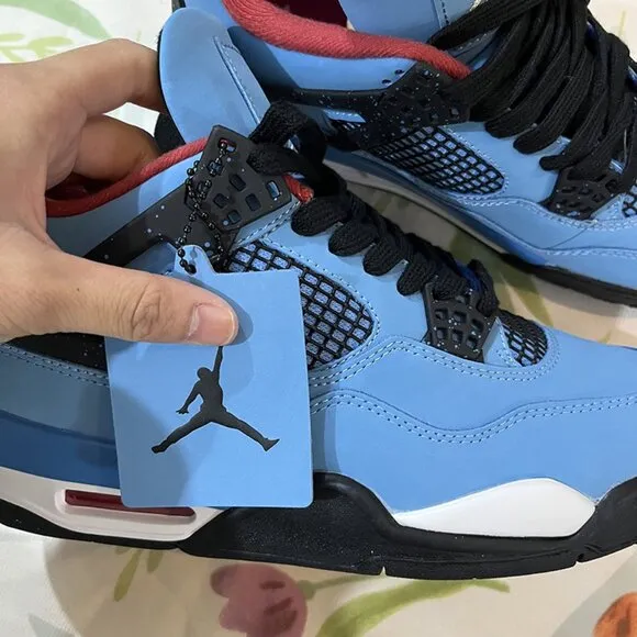 Air Jordan 4 blue and black sneakers