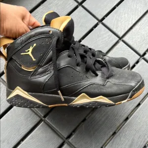 Black and Gold Air Jordan Sneakers