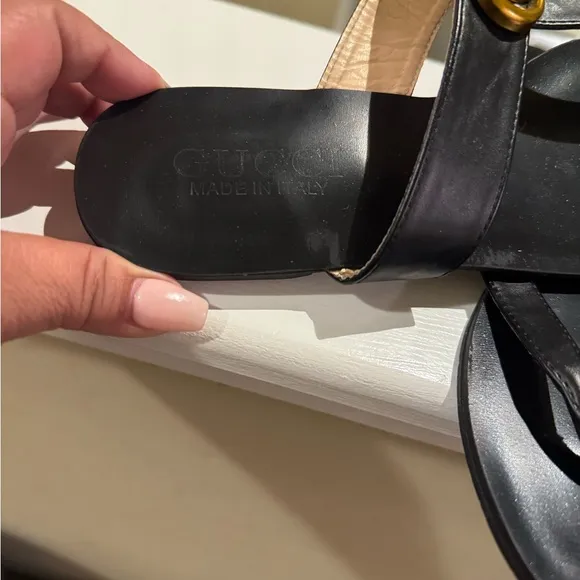 Black Thong Sandals with Gold Embellishments