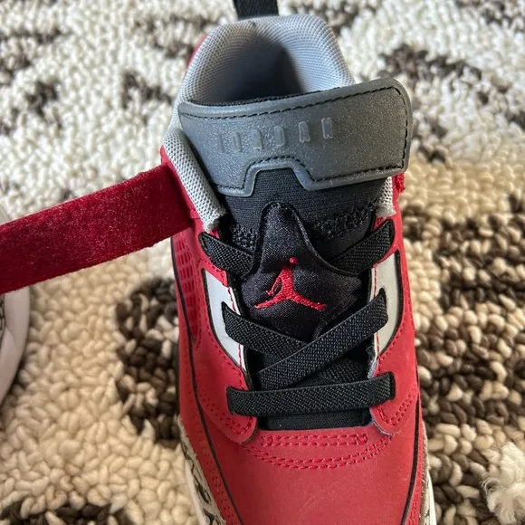 Kids Jordan’s Red and Black Sneakers