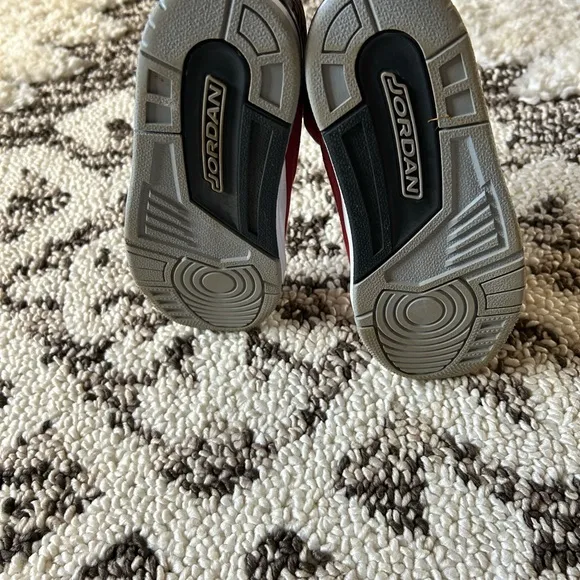 Kids Jordan’s Red and Black Sneakers