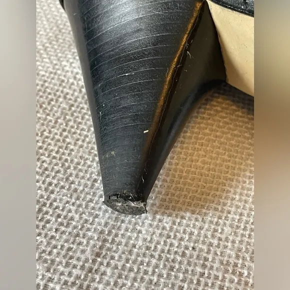 Michael.  Michael Kors black boots with buckle