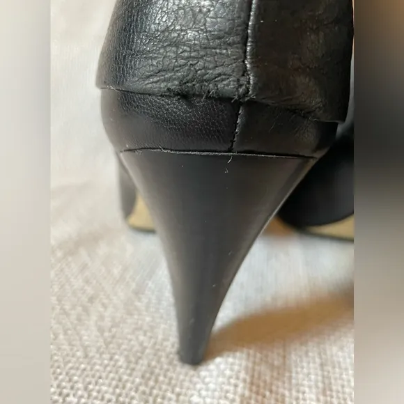 Michael.  Michael Kors black boots with buckle