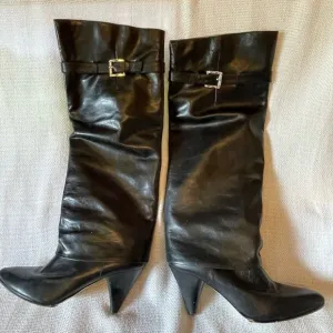 Michael.  Michael Kors black boots with buckle