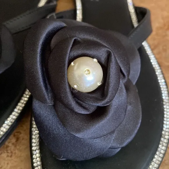 Ninety Union black, satin, crystal, and pearl flower thong sandals