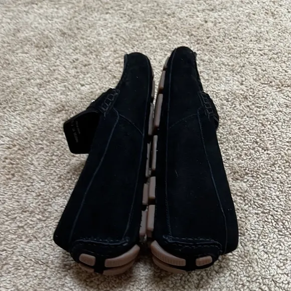 NWOB! Cole Haan SZ 8C black faux fur lined buckle front suede loafers.
