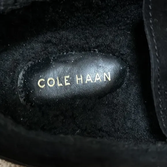 NWOB! Cole Haan SZ 8C black faux fur lined buckle front suede loafers.