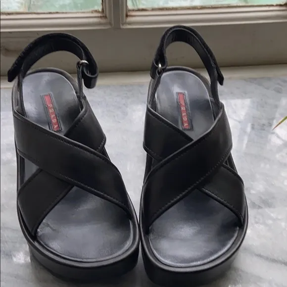 Prada cross cross sandals with wavy sole