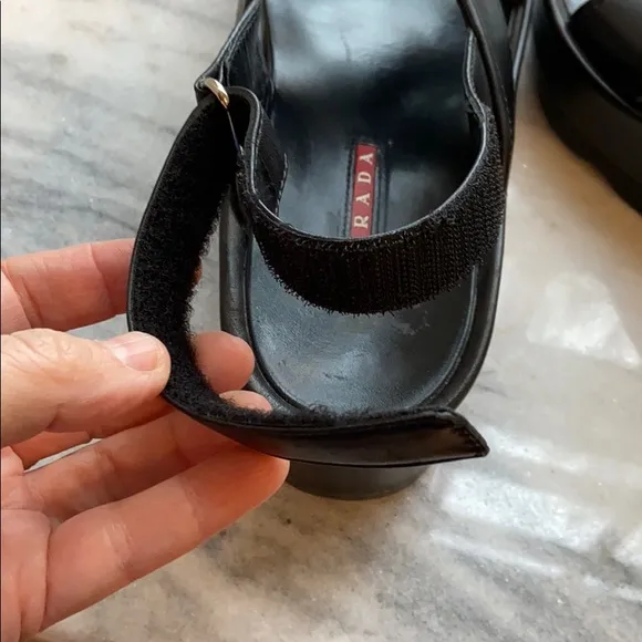 Prada cross cross sandals with wavy sole