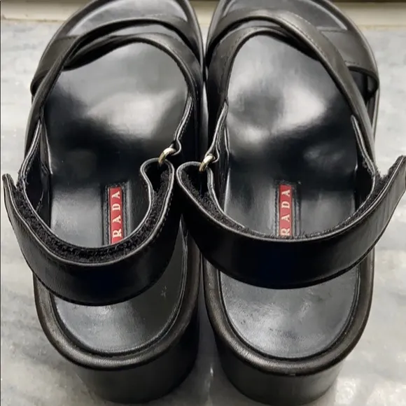 Prada cross cross sandals with wavy sole