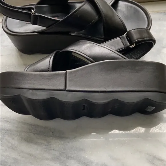 Prada cross cross sandals with wavy sole