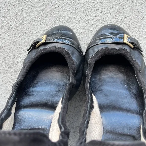 Tod’s “Dee” Black Patent Leather Buckle Ballet Flats