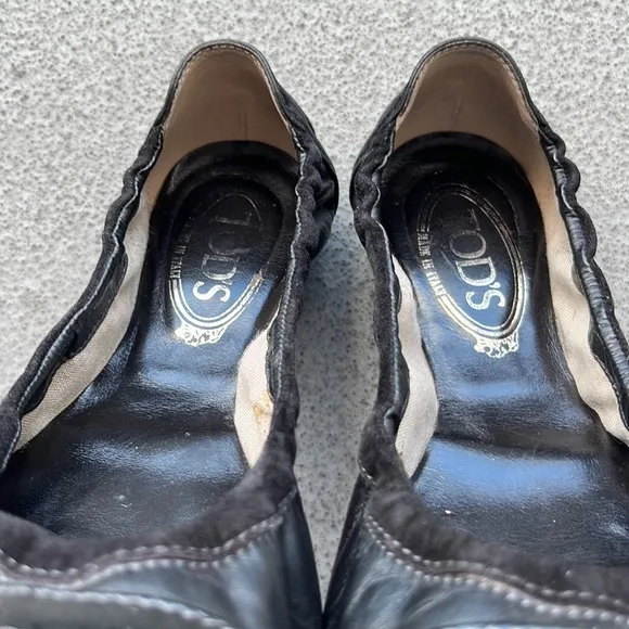 Tod’s “Dee” Black Patent Leather Buckle Ballet Flats