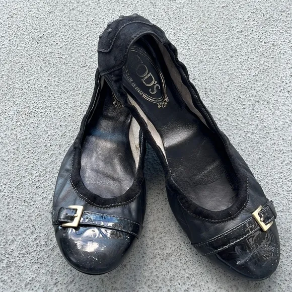Tod’s “Dee” Black Patent Leather Buckle Ballet Flats